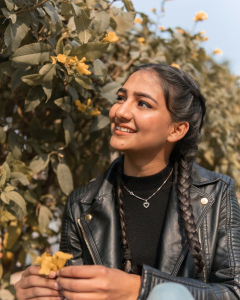 A creator smiling outdoors